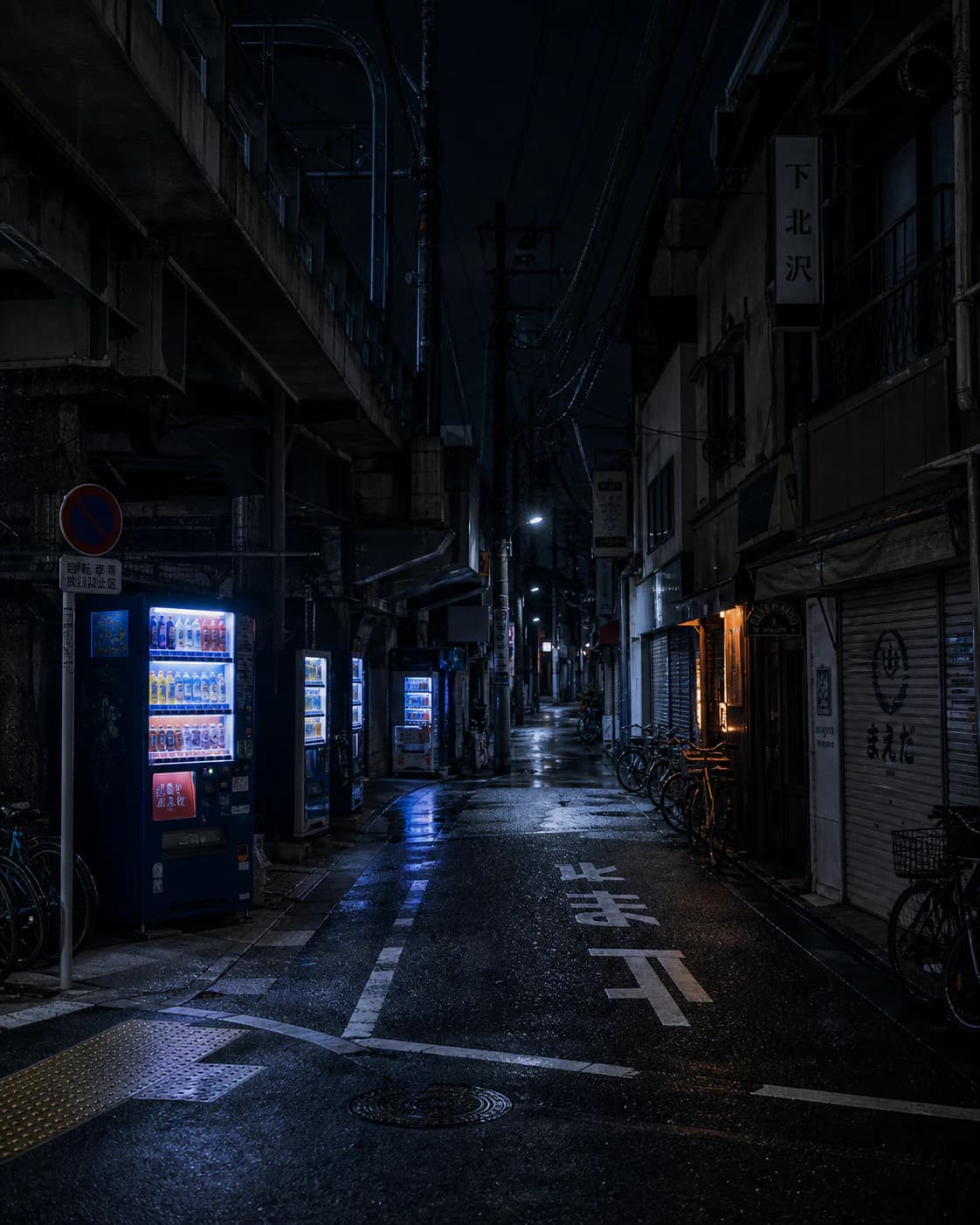 Shimokitazawa after the last train with glowing vending machines, bicycles, Japanese road markings, and closed storefronts